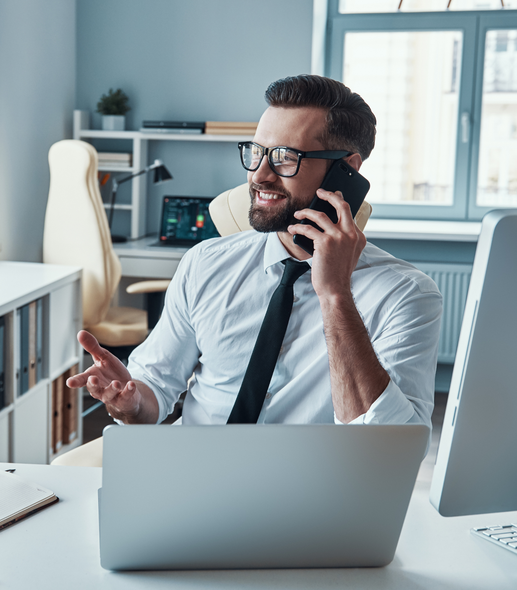 Professional talking on the phone at his desk